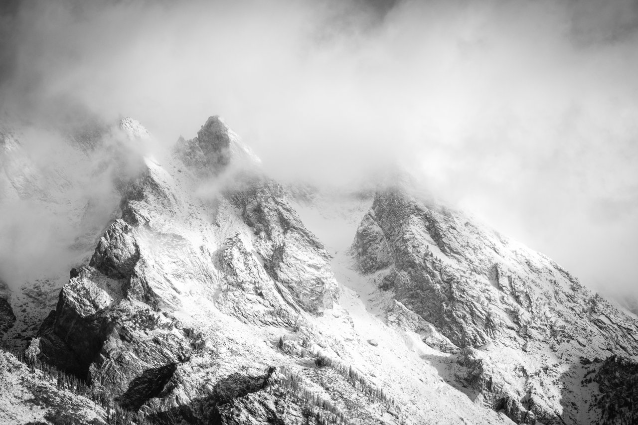 Mount Moran, shrouded in clouds after an early autumn snowfall.