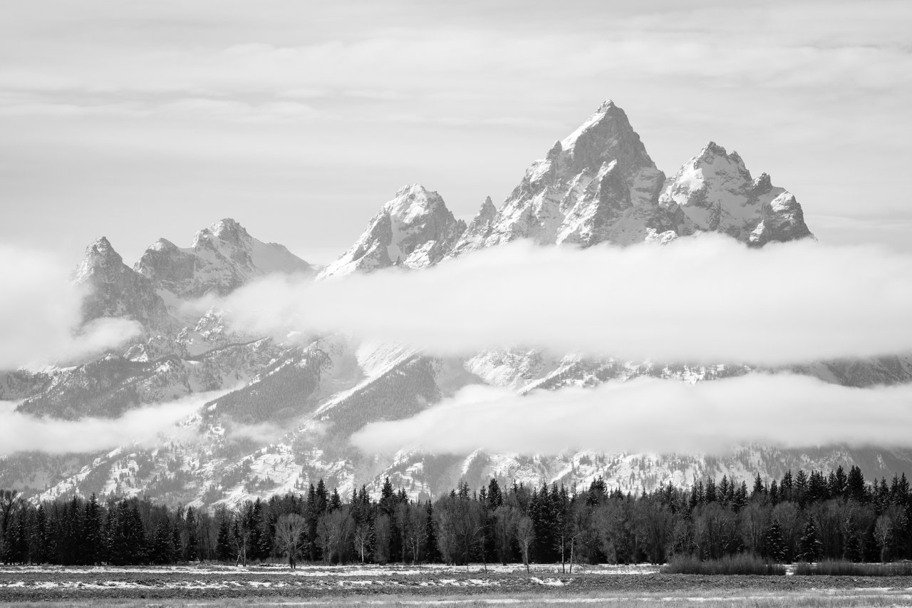 The Teton Range, partially covered by clouds, from Elk Ranch Flats